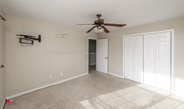 unfurnished bedroom featuring ceiling fan, carpet, and a closet