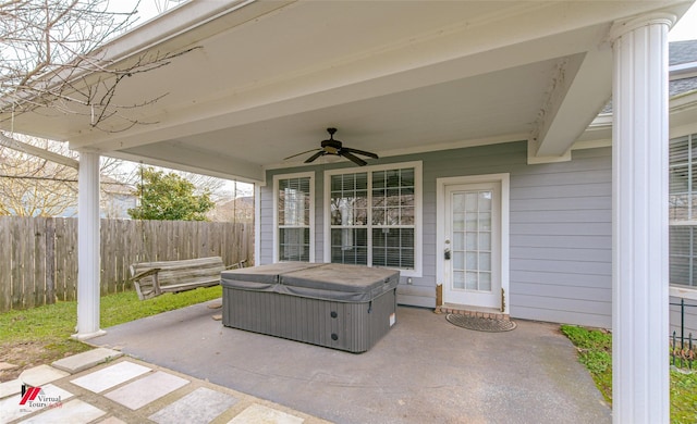 view of patio featuring a hot tub and ceiling fan