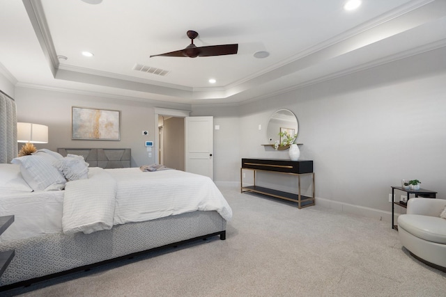 bedroom with crown molding, carpet floors, ceiling fan, and a raised ceiling