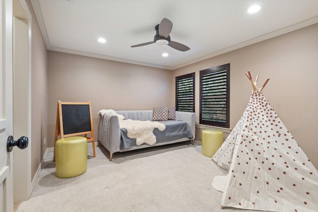 bedroom with ceiling fan, ornamental molding, and carpet flooring