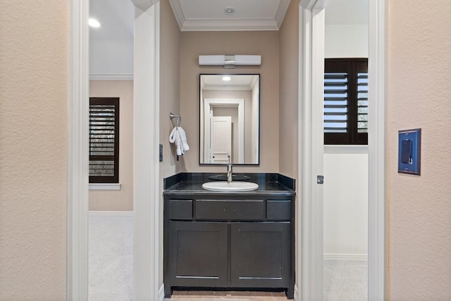 bathroom featuring vanity and ornamental molding