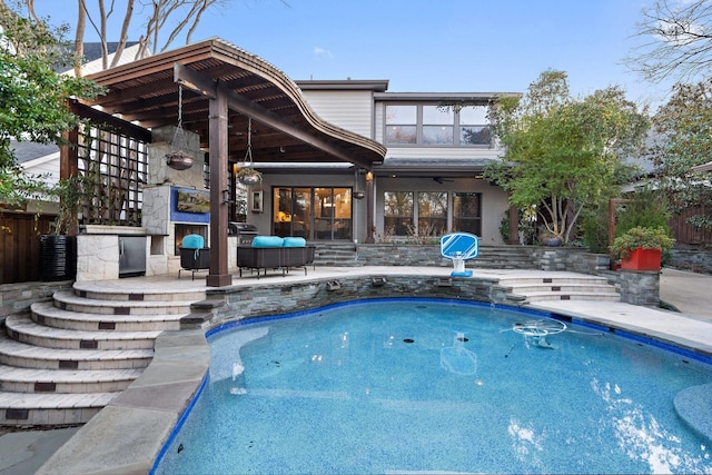 view of pool with a patio area and a fireplace