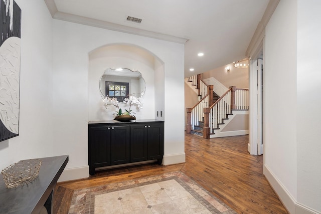 corridor featuring crown molding