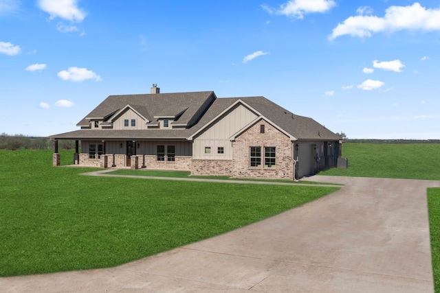 view of front of property featuring a garage and a front lawn