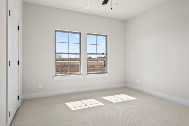 unfurnished bedroom with ceiling fan and light carpet