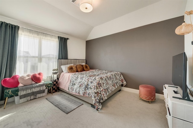 carpeted bedroom featuring lofted ceiling