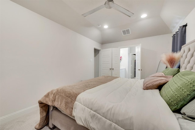 bedroom featuring ceiling fan, light carpet, and vaulted ceiling