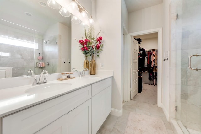 bathroom with vanity, walk in shower, and tile patterned floors