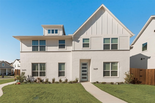 view of front of property with a front lawn