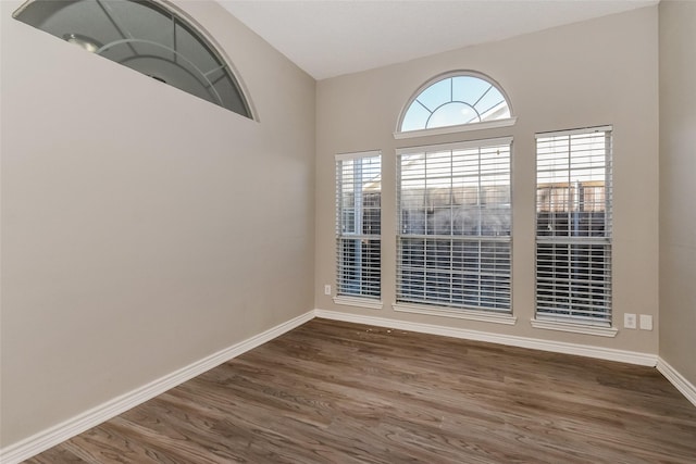 spare room featuring dark hardwood / wood-style floors