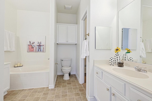 bathroom featuring a relaxing tiled tub, vanity, and toilet