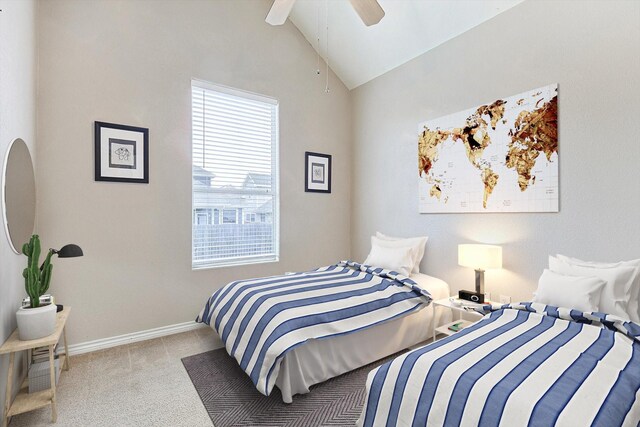 spare room featuring lofted ceiling, carpet flooring, and ceiling fan