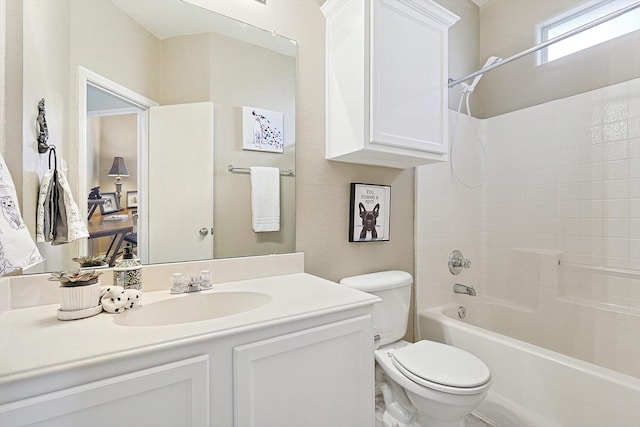 full bathroom featuring washtub / shower combination, vanity, and toilet