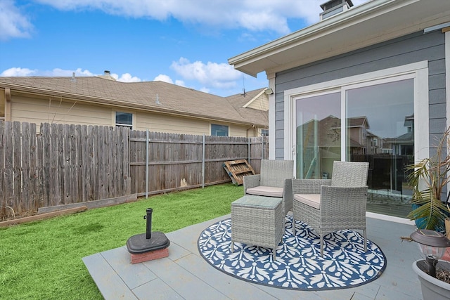 view of patio / terrace featuring fence