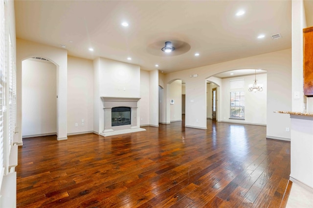 unfurnished living room featuring dark wood-type flooring