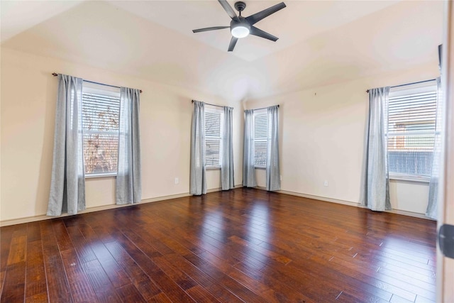 unfurnished room with ceiling fan, dark wood-type flooring, and vaulted ceiling