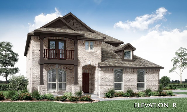 view of front of home with a balcony and a front yard