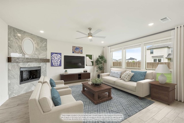 4601 Nomad Dr, Midlothian, TX 76065 - living room featuring ceiling fan, a premium fireplace, recessed lighting, and wood finished floors