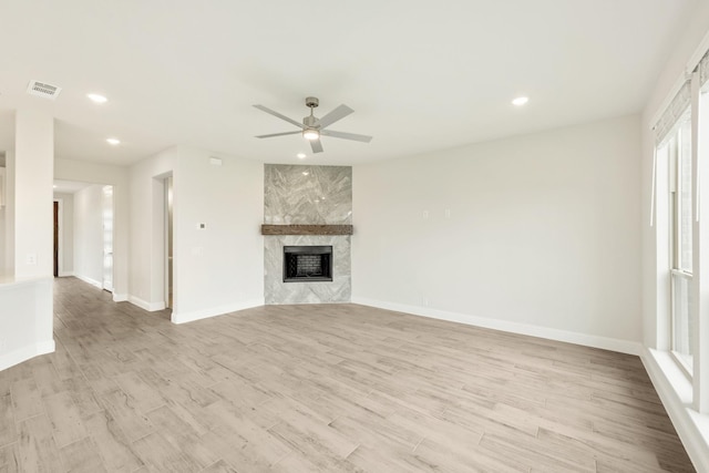 unfurnished living room with visible vents, recessed lighting, ceiling fan, and light wood-type flooring
