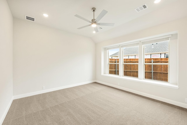 carpeted empty room featuring a ceiling fan, baseboards, and visible vents