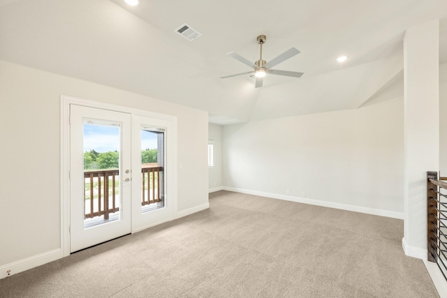 spare room with ceiling fan, lofted ceiling, baseboards, and carpet