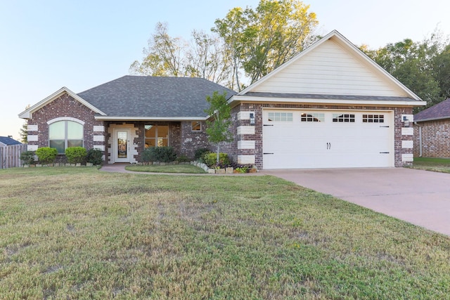 view of front facade with a front yard and a garage