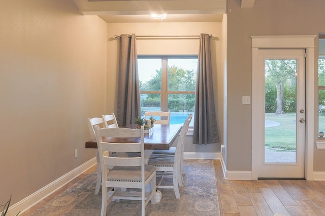 dining space with hardwood / wood-style flooring