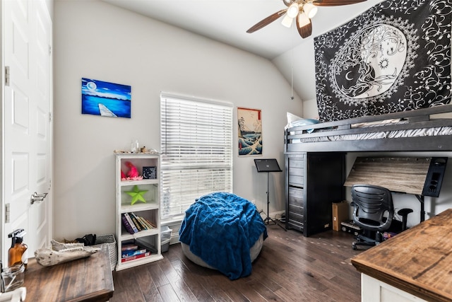 bedroom featuring ceiling fan, dark hardwood / wood-style floors, and vaulted ceiling