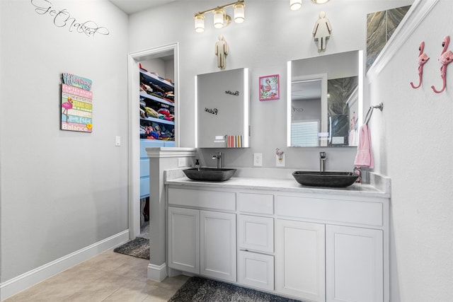 bathroom with vanity and tile patterned flooring