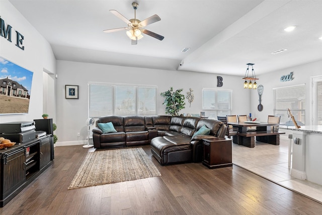 living room featuring visible vents, baseboards, a ceiling fan, dark wood-style floors, and recessed lighting