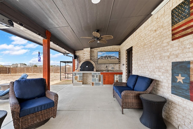 view of patio / terrace with area for grilling and ceiling fan