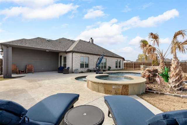 view of pool featuring an in ground hot tub and a patio area