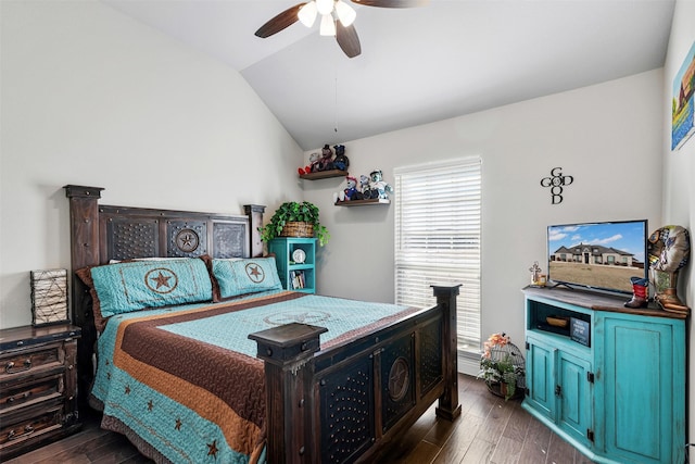 bedroom featuring ceiling fan, dark hardwood / wood-style floors, and lofted ceiling