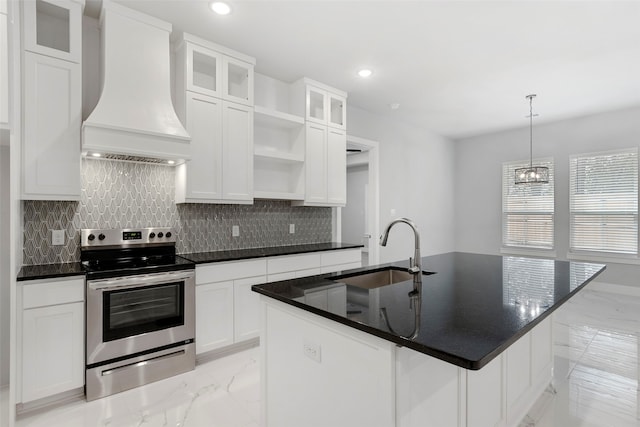 kitchen featuring white cabinetry, an island with sink, electric stove, premium range hood, and sink