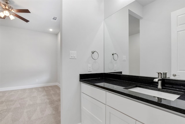 bathroom with ceiling fan and vanity