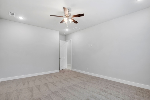 unfurnished room with light carpet and ceiling fan