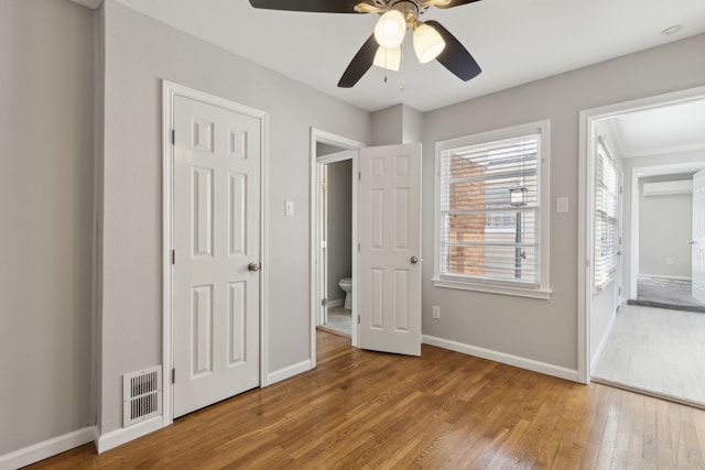 unfurnished bedroom featuring light hardwood / wood-style flooring and ceiling fan