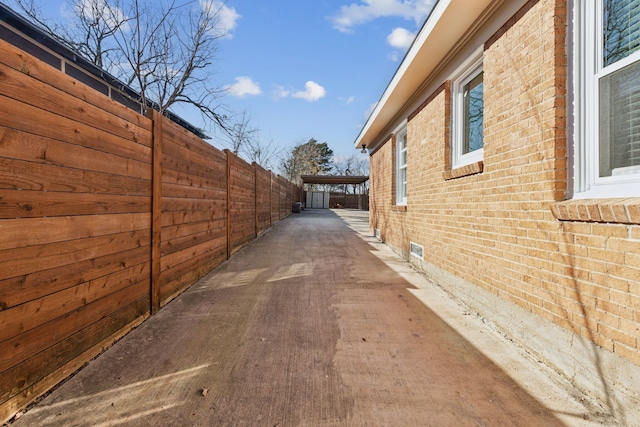 view of home's exterior featuring a carport