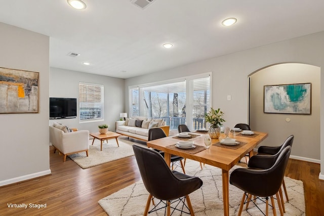 dining room with hardwood / wood-style flooring