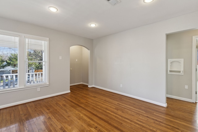 unfurnished room featuring dark hardwood / wood-style floors