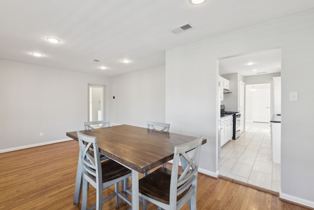 dining area with light wood-type flooring