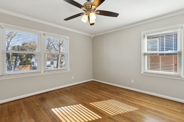 empty room with crown molding, wood-type flooring, and ceiling fan