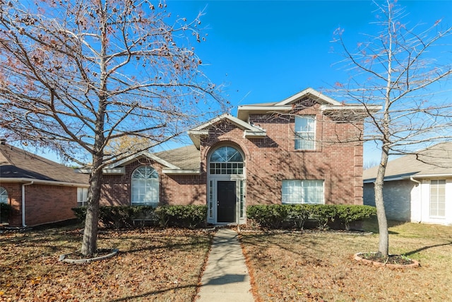 front facade featuring a front lawn