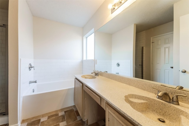 bathroom featuring a bath and vanity