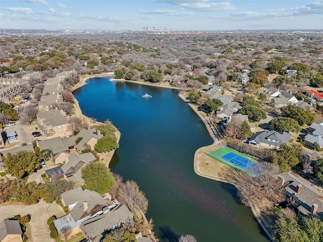 drone / aerial view featuring a water view and a residential view