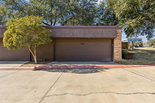 garage with concrete driveway