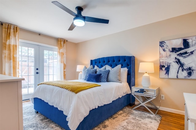 bedroom featuring ceiling fan, access to exterior, hardwood / wood-style floors, and french doors