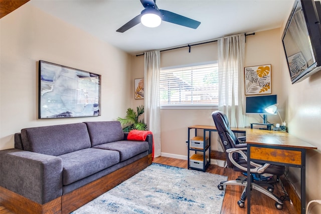 office featuring hardwood / wood-style floors and ceiling fan