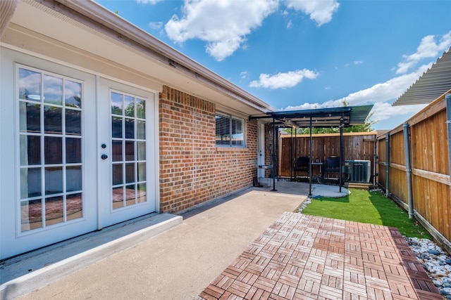 view of patio / terrace with central AC unit and french doors