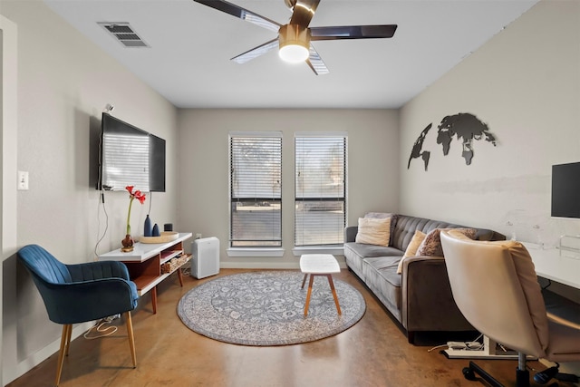 office featuring ceiling fan and concrete flooring